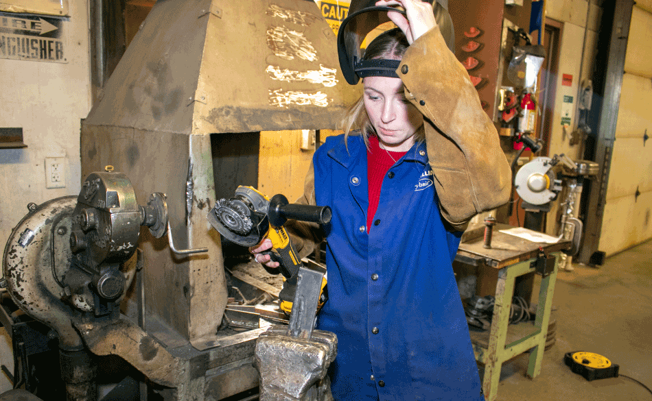 Montana high school student learning how to fix cars in their CTE class